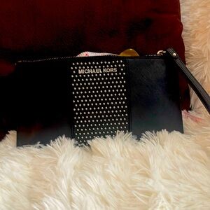 Michael kors studded wristlet black 10by 5 used only  a few times